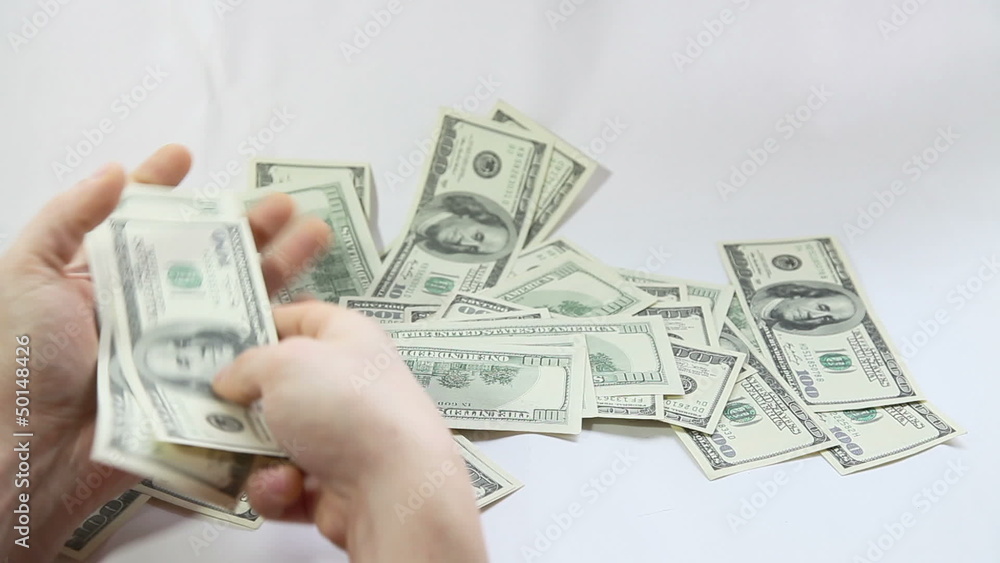 Man counting american dollars on white background Man counting american dollars on white background