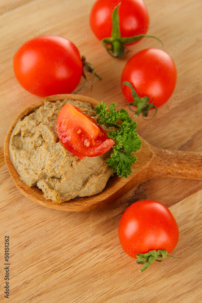 Fresh pate on wooden spoon, on wooden background Fresh pate on wooden spoon, on wooden background