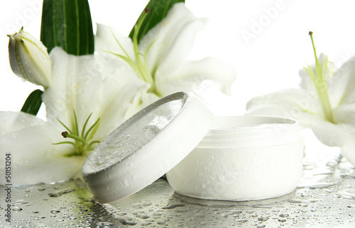 Fototapeta Naklejka Na Ścianę i Meble -  Cosmetic cream and beautiful lily, close up