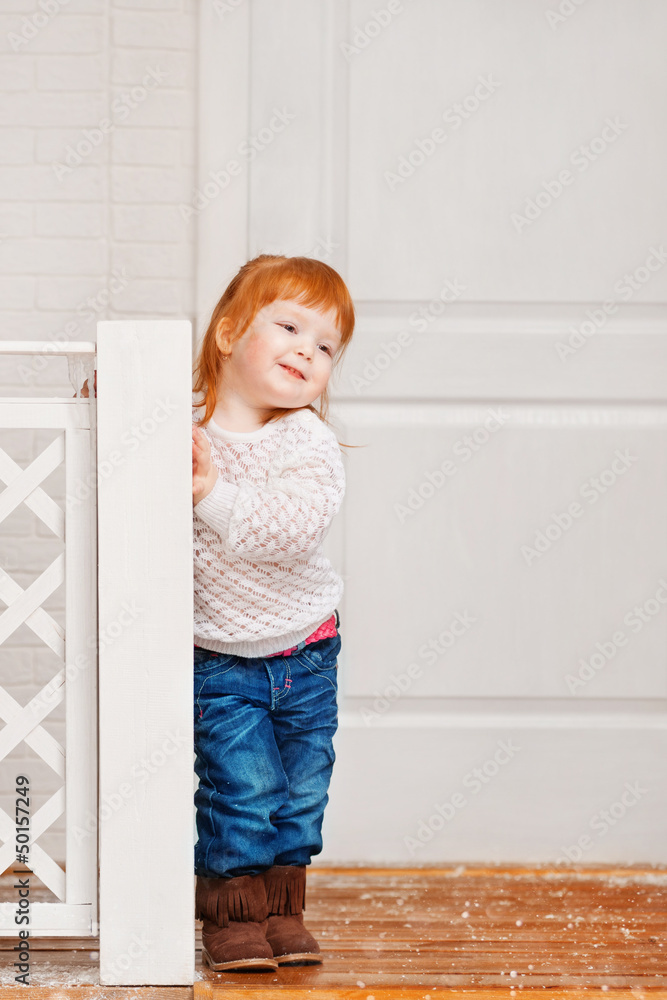 Little girl playing on the porch Little girl playing on the porch