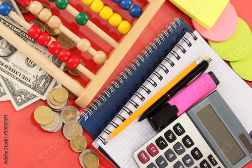 Bright wooden abacus and calculator. Conceptual photo of old