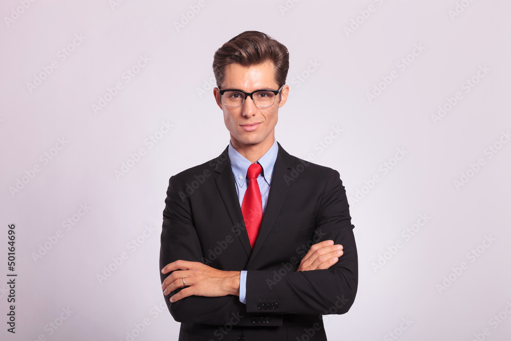 business man standing with hands folded business man standing with hands folded