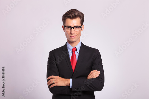 business man standing with hands folded