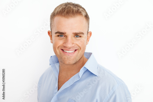 Closeup portrait of happy smiling young businessman © GVS