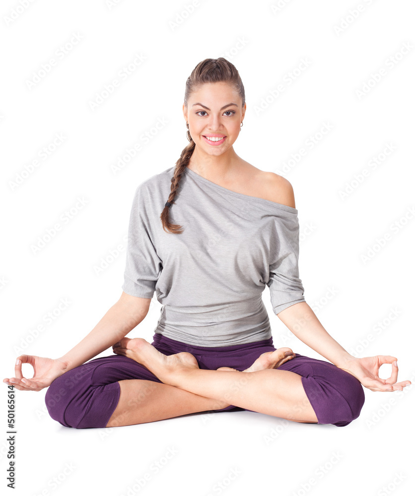 Young woman doing yoga exercise Padmasana (Lotus Pose). Young woman doing yoga exercise Padmasana (Lotus Pose).