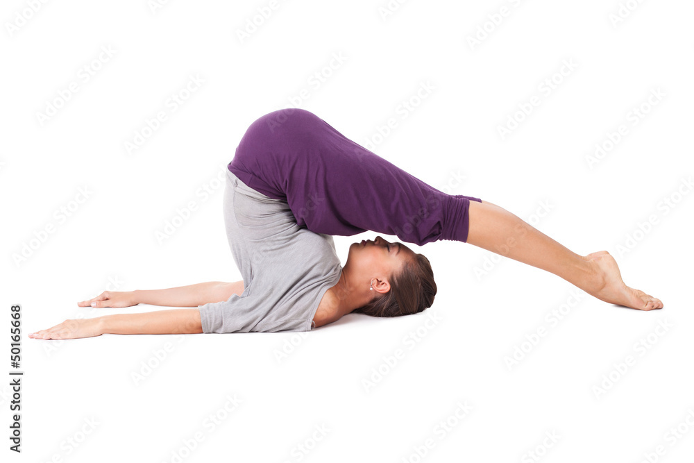 Young woman doing yoga exercise Halasana (Plow Pose). Isolated o Young woman doing yoga exercise Halasana (Plow Pose). Isolated o