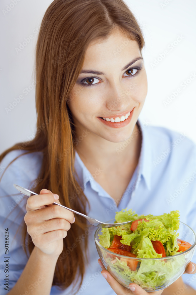 happy young woman eating a fresh salad happy young woman eating a fresh salad