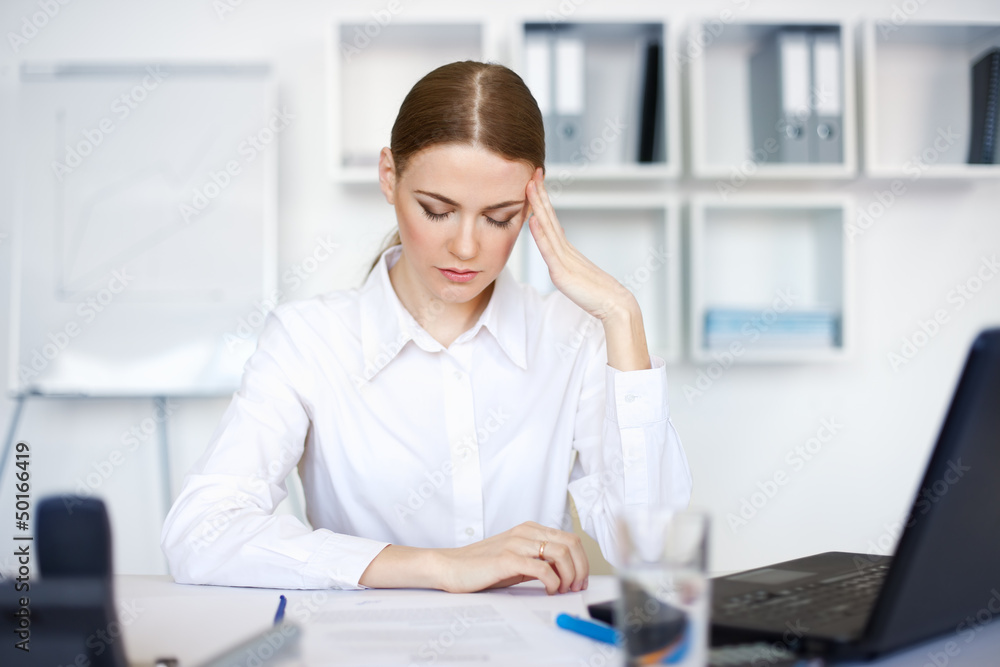 tired young business woman with laptop computer tired young business woman with laptop computer