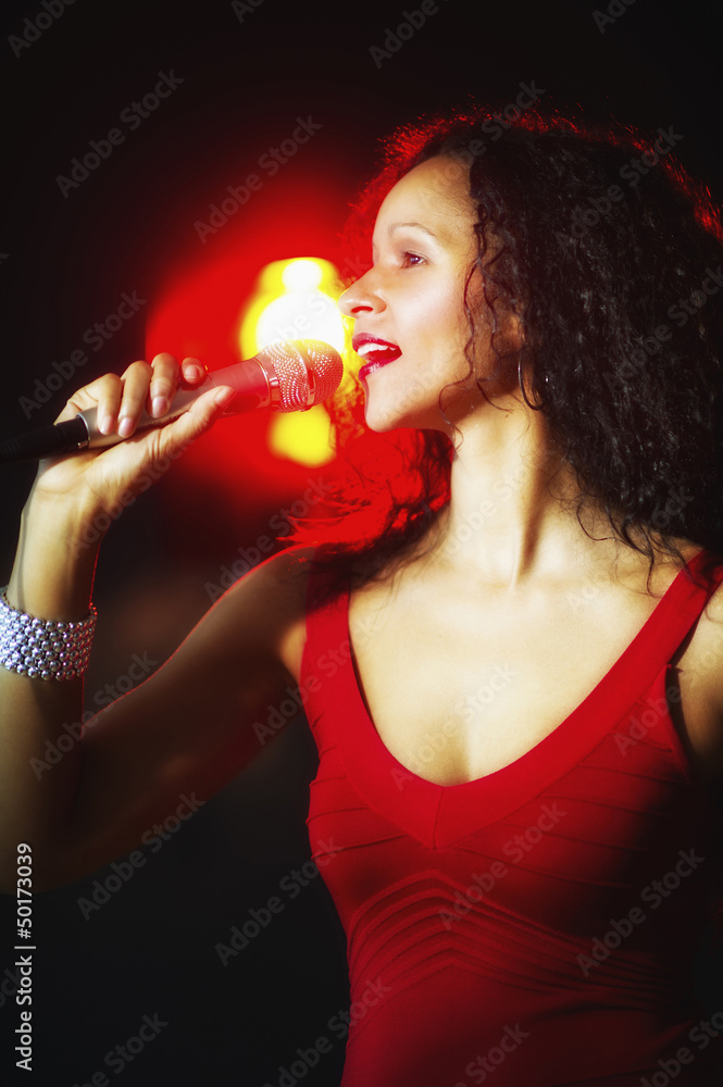Hispanic woman singing in nightclub Hispanic woman singing in nightclub