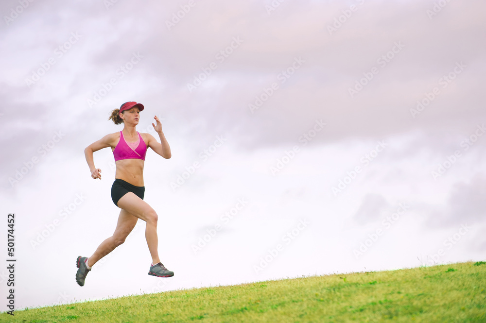 Caucasian woman running in park Caucasian woman running in park