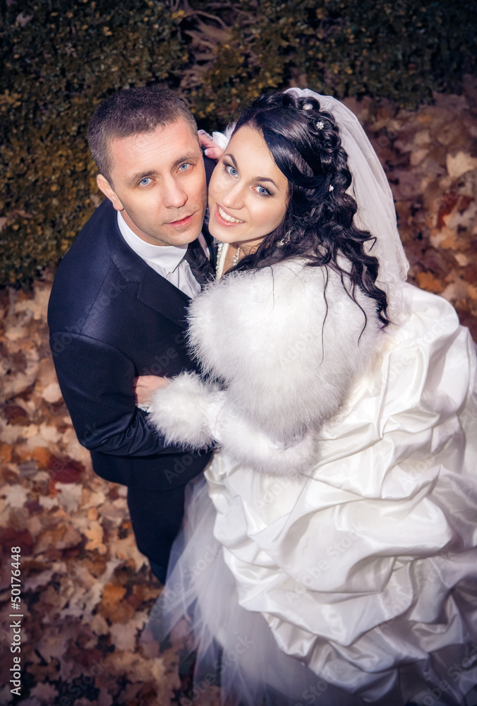 Wedding shot of bride and groom in park Wedding shot of bride and groom in park