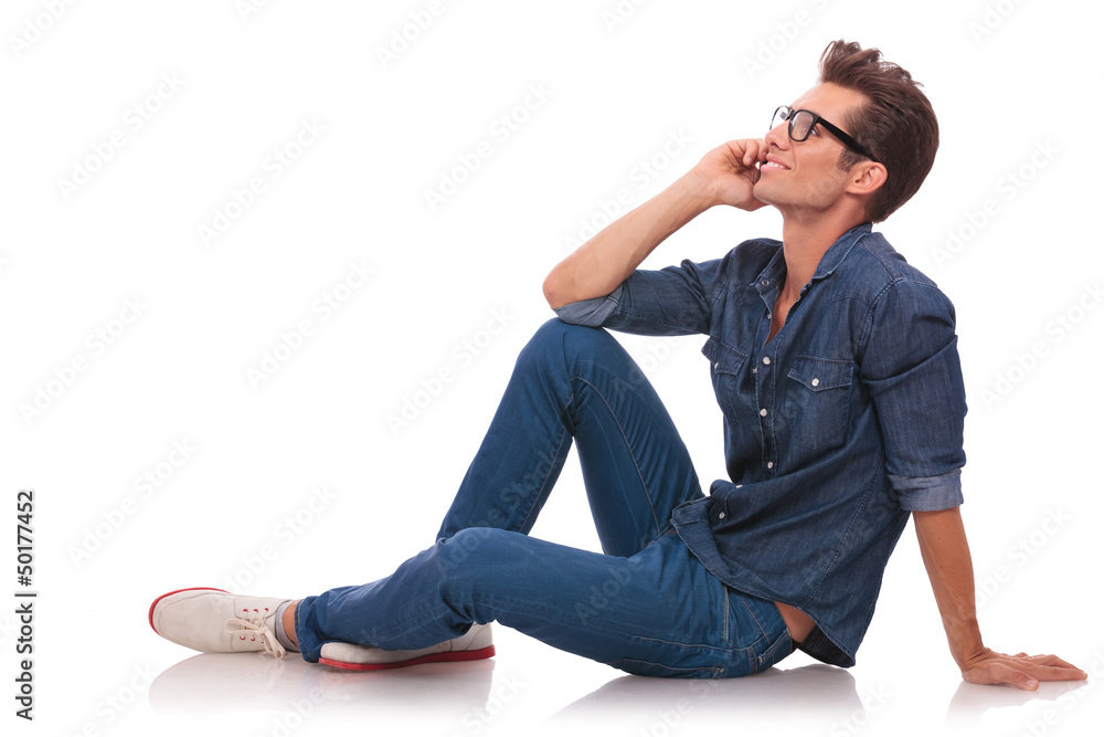 side view of seated man on phone side view of seated man on phone