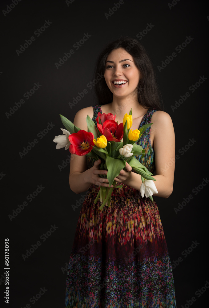 Beautiful young girl with a bouquet of flowers, Spring. studio p Beautiful young girl with a bouquet of flowers, Spring. studio p