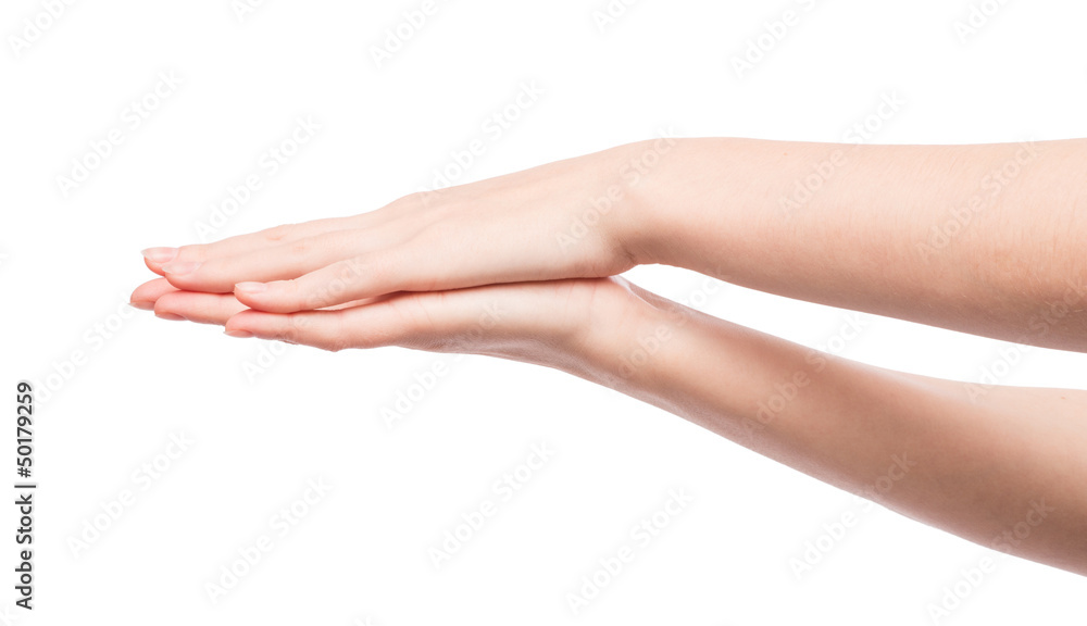 Woman rubs hand cream, makes a hand massage