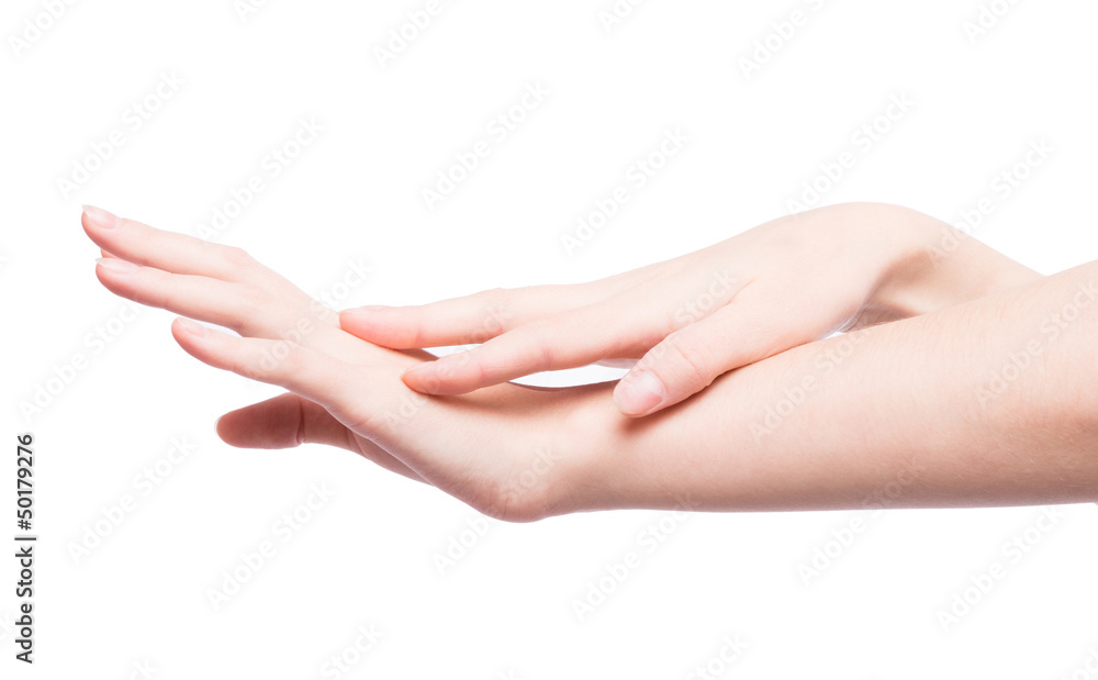 Woman rubs hand cream