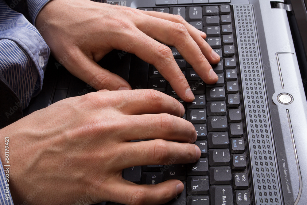 Businessman holding a laptop and is working on it Businessman holding a laptop and is working on it