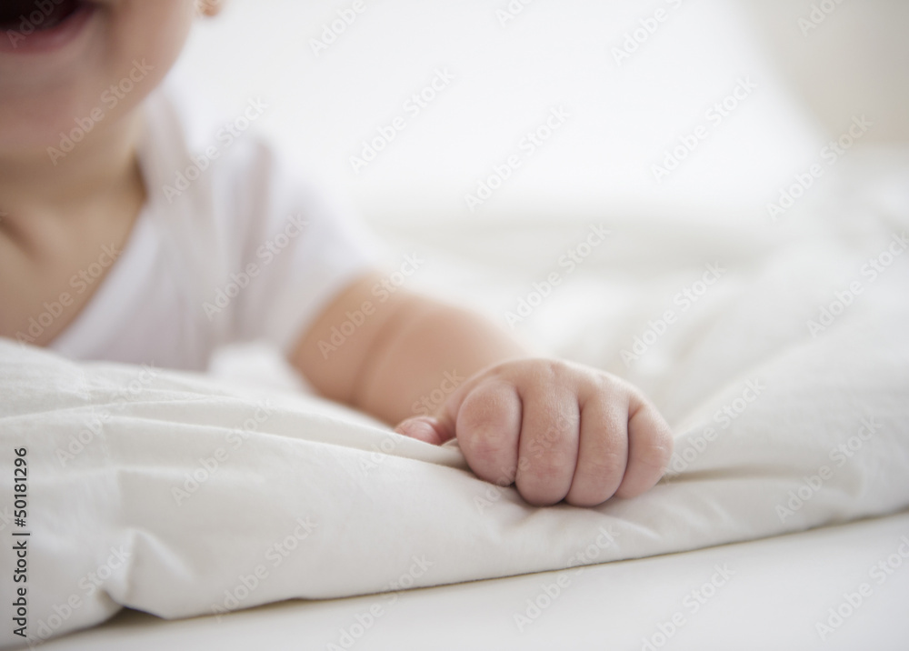 Mixed race baby boy laying on floor Mixed race baby boy laying on floor