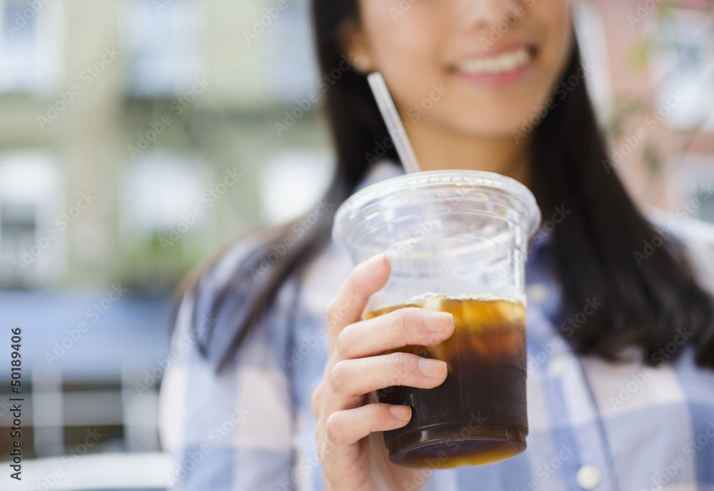 Asian woman drinking iced coffee Asian woman drinking iced coffee