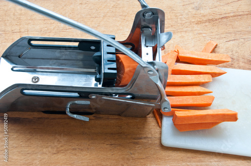 Sweet potato being cut into fries