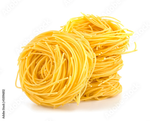 Italian egg pasta nest isolated on white background photo