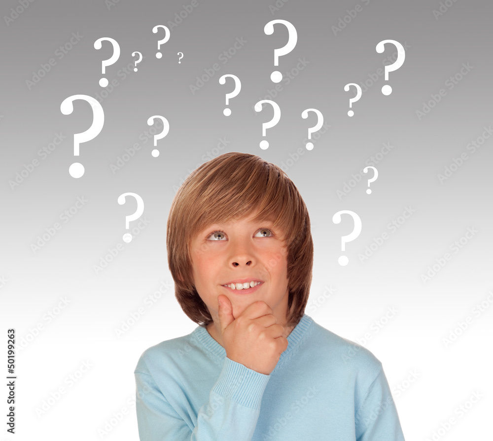 Doubtful preteen boy with many question symbols Doubtful preteen boy with many question symbols