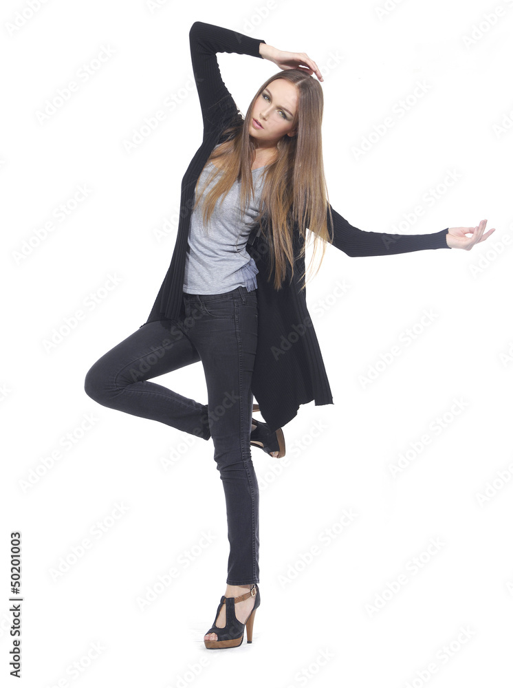 Full length The young long-haired girl posing in studio Full length The young long-haired girl posing in studio