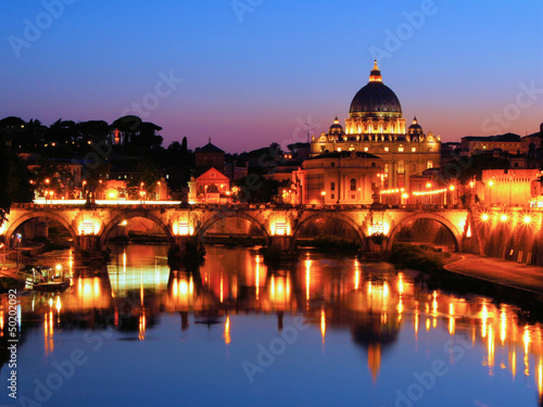 Night view of the Vatican across the Tiber River of Rome, Italy