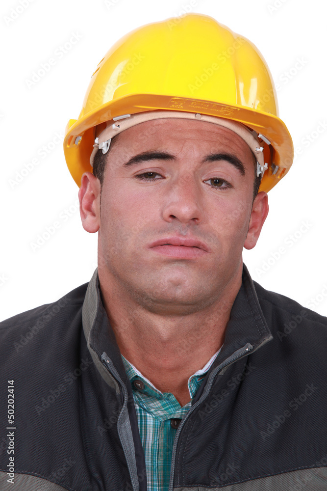 A bored construction worker. A bored construction worker.