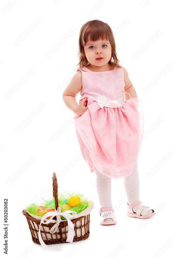 little girl standing near basket little girl standing near basket