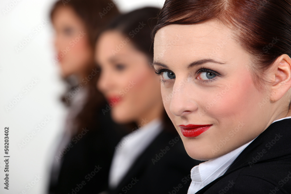 Portrait of three women in a row Portrait of three women in a row