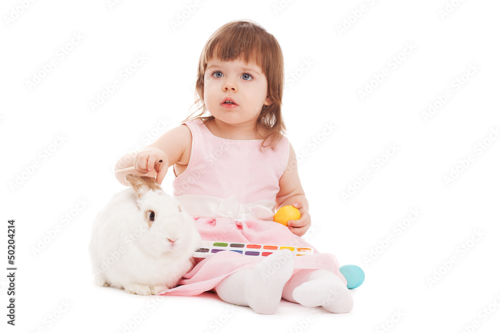 little girl painting easter eggs little girl painting easter eggs