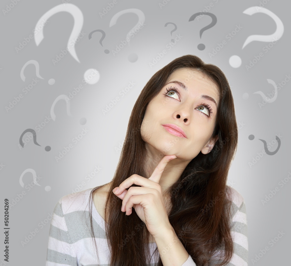 Beautiful girl with questioning thinks and question marks above Beautiful girl with questioning thinks and question marks above