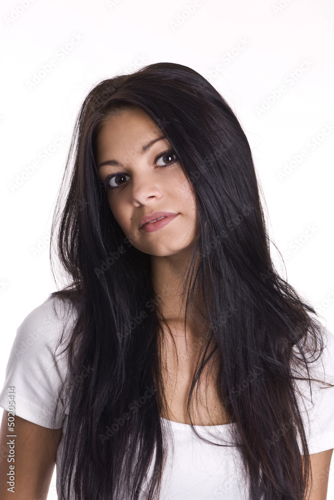 Young happy attractive girl posing in studio .