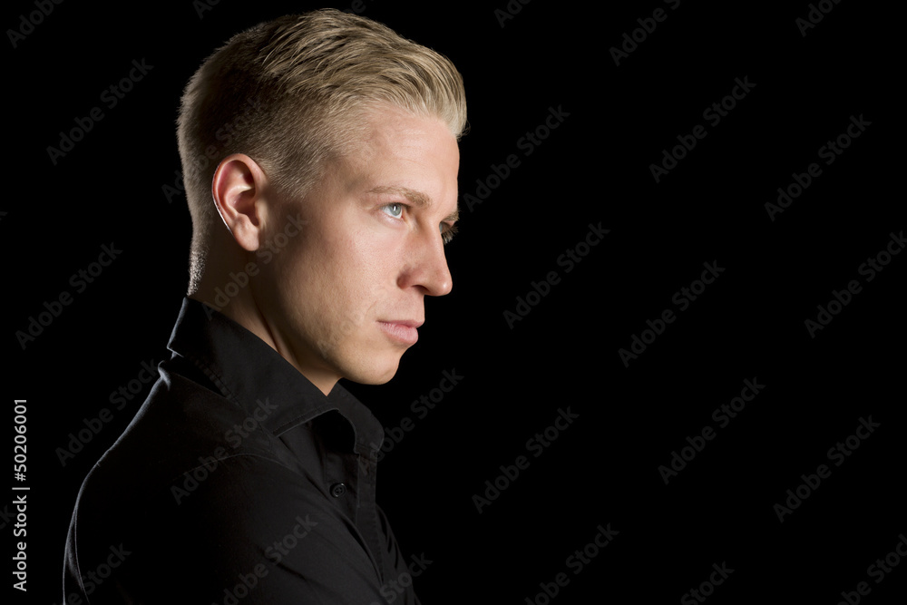 Fototapeta premium Profile low key portrait of attractive man.