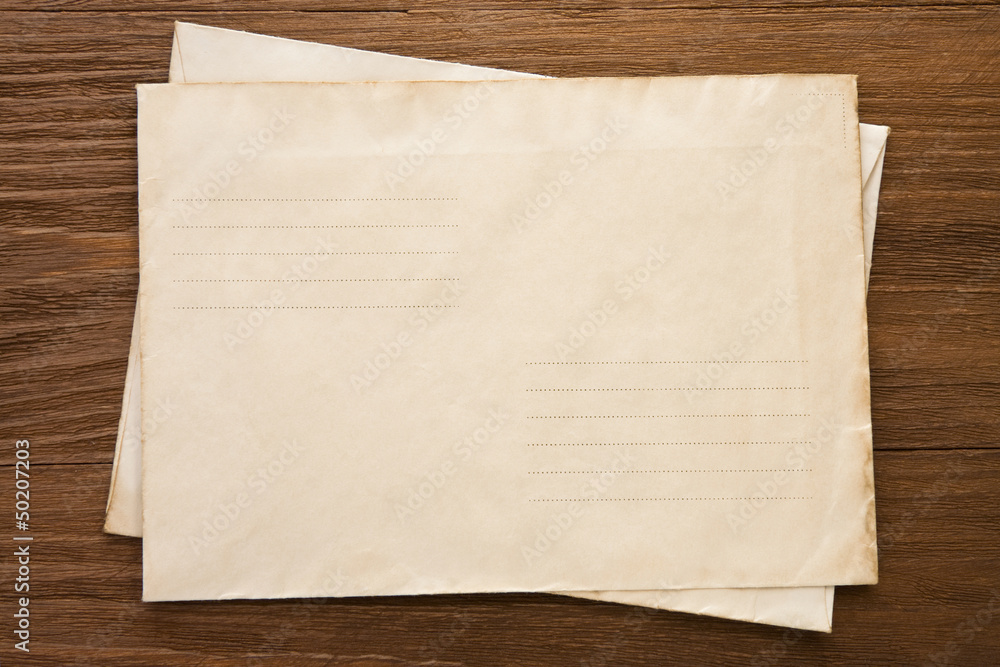 old postal envelope on wood