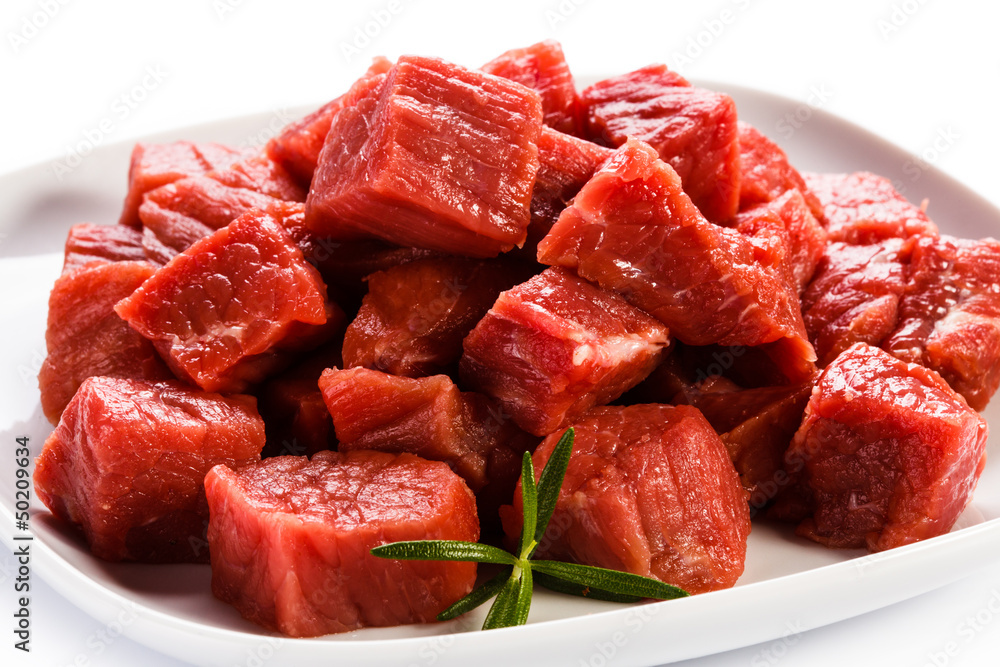 Raw beef and vegetables on white background Raw beef and vegetables on white background