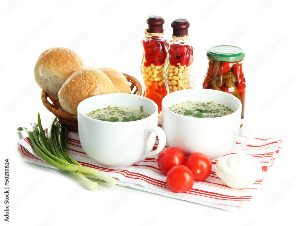 Fragrant soup in cups isolated on white Fragrant soup in cups isolated on white