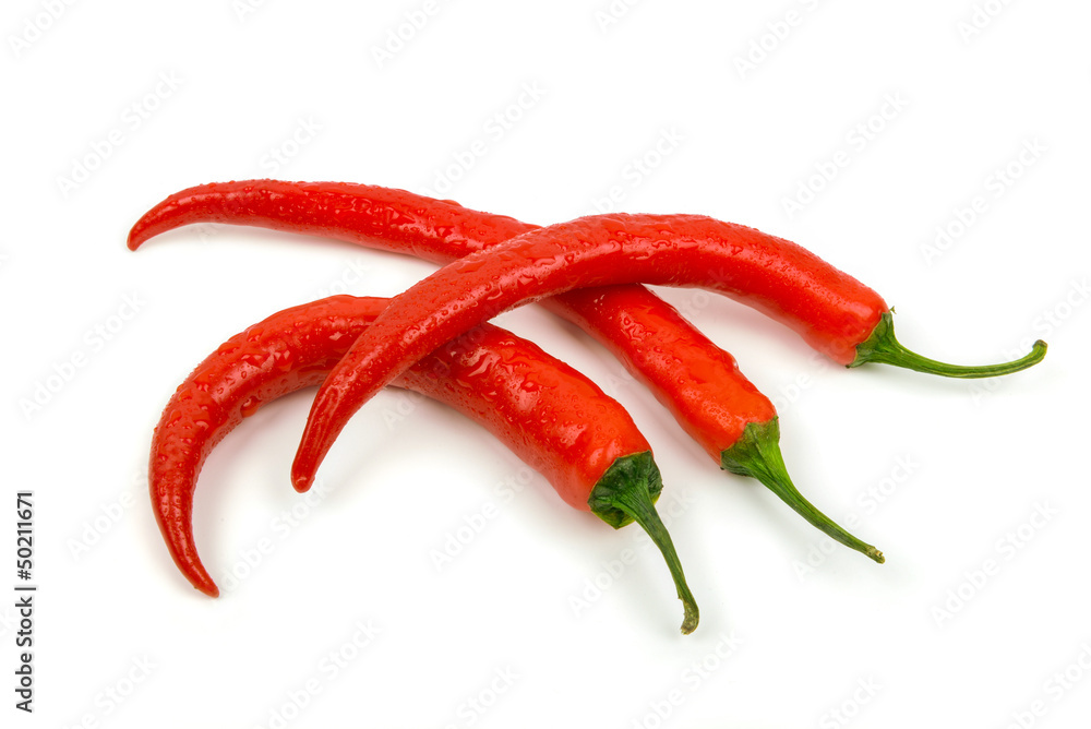 three recently rinsed chili peppers