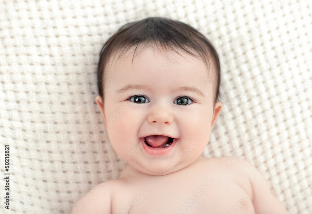 portrait of a baby who smiles portrait of a baby who smiles