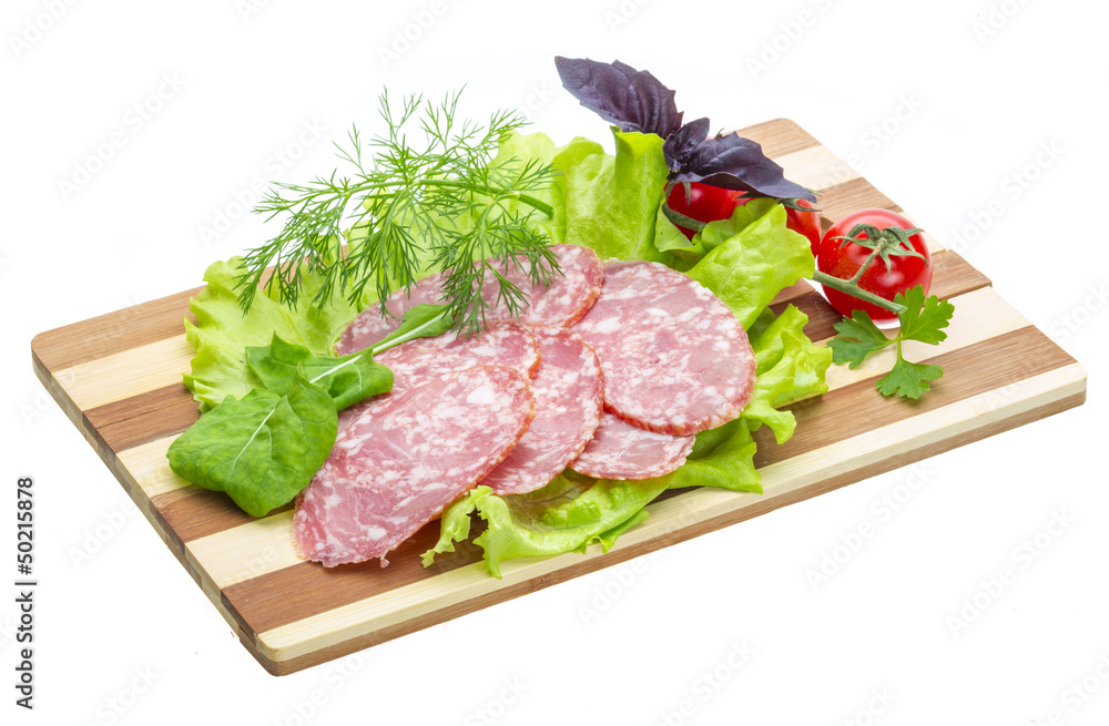 Sausages with salad and basil