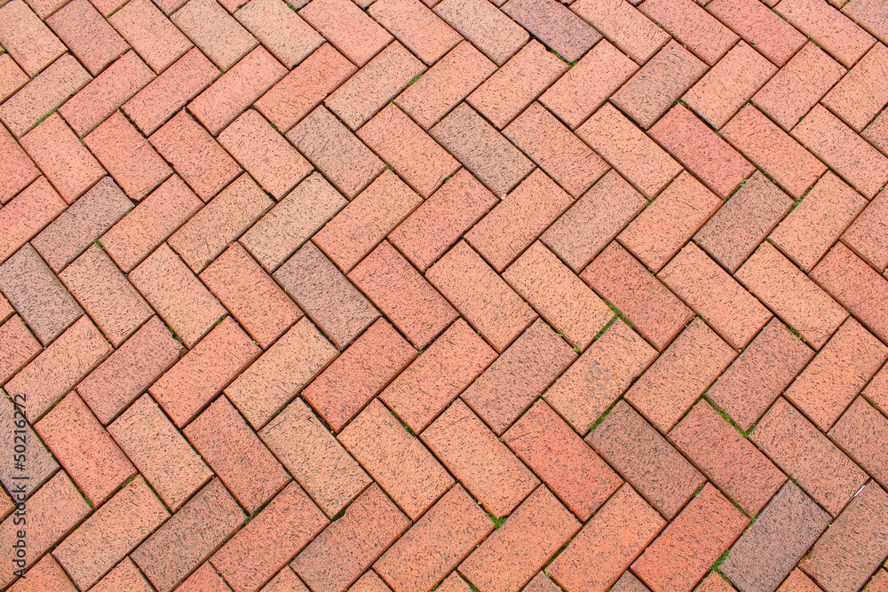 Red brick paving stones on a sidewalk Red brick paving stones on a sidewalk