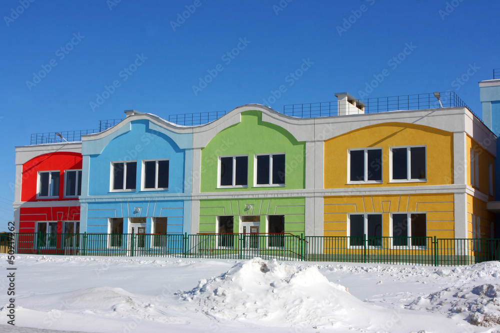 Modern colorful houses against a blue sky in the winter Modern colorful houses against a blue sky in the winter