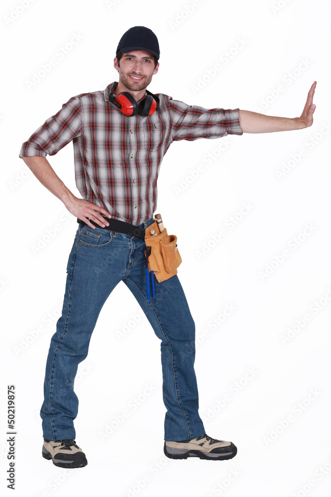 Tradesman pushing an invisible wall Tradesman pushing an invisible wall