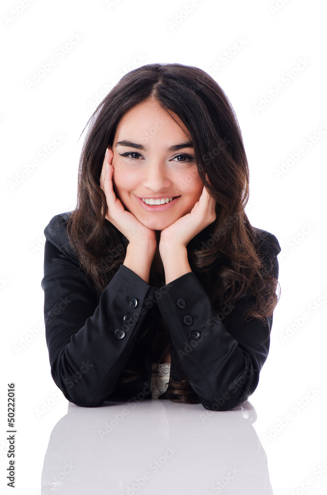 Young businesswoman sitting at desk on white Young businesswoman sitting at desk on white