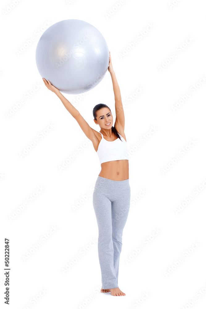 Woman doing exercises with fitness ball