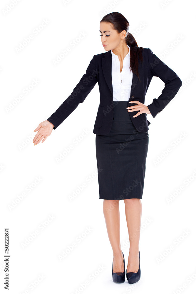 Business woman standing and pointing at copy space Business woman standing and pointing at copy space