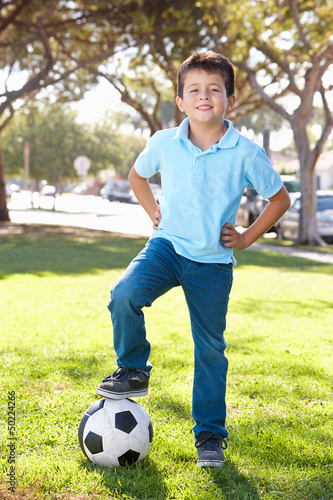 Boy Posing With Soccer ball © Monkey Business