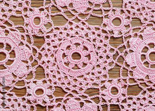Crochet lace on a wooden su...