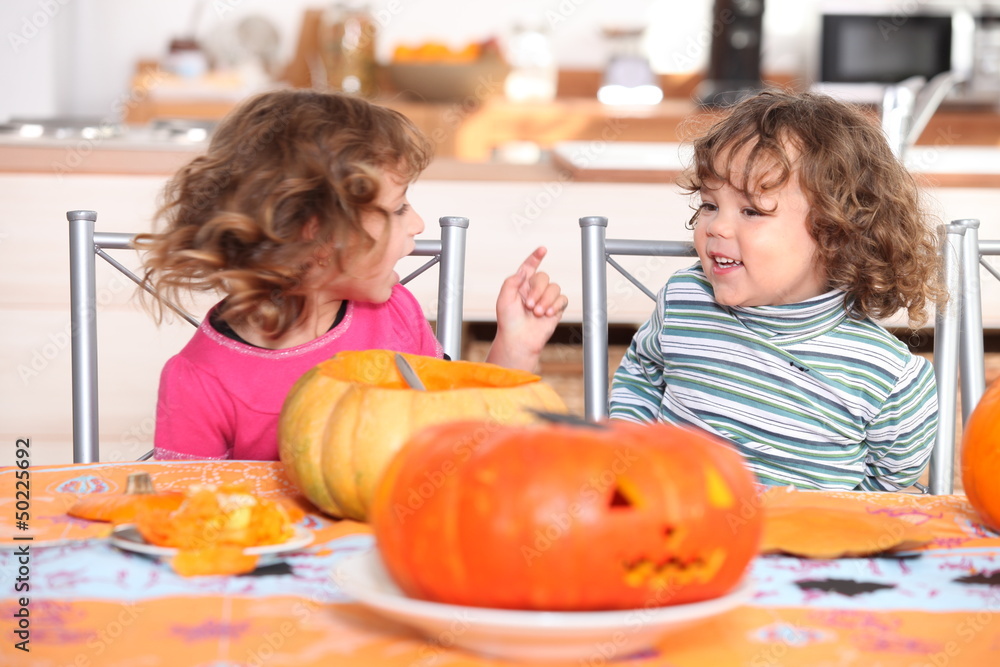 Fototapeta premium Children carving pumpkins