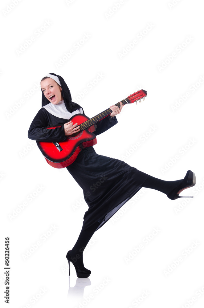 Nun playing guitar isolated on white Nun playing guitar isolated on white
